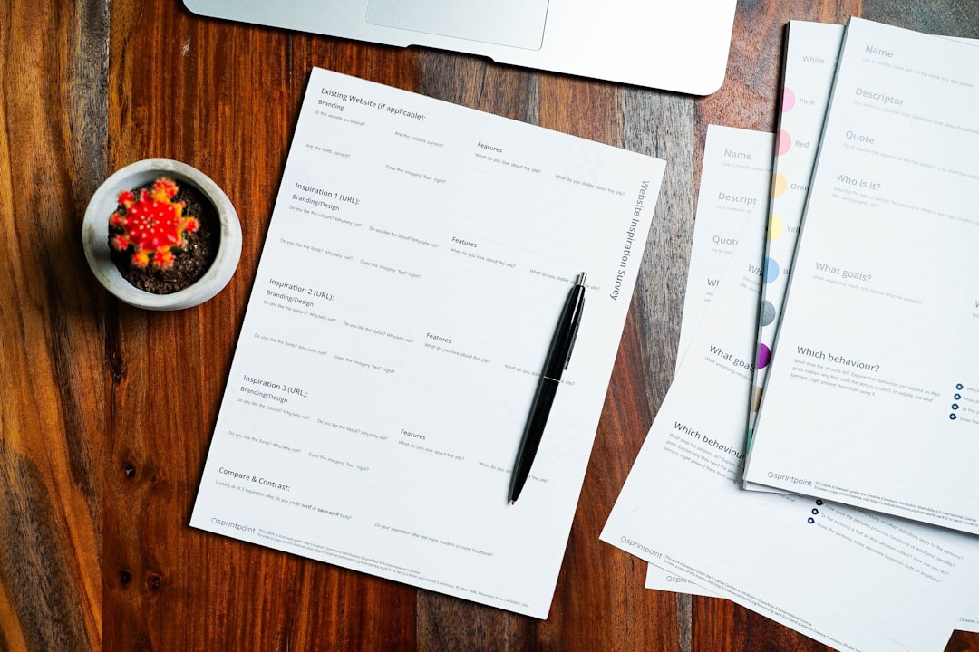 person checking document checklist — Photo by 2H Media on Unsplash. Source: https://unsplash.com/photos/a-wooden-table-topped-with-papers-and-a-pen-spScdgWY-_c