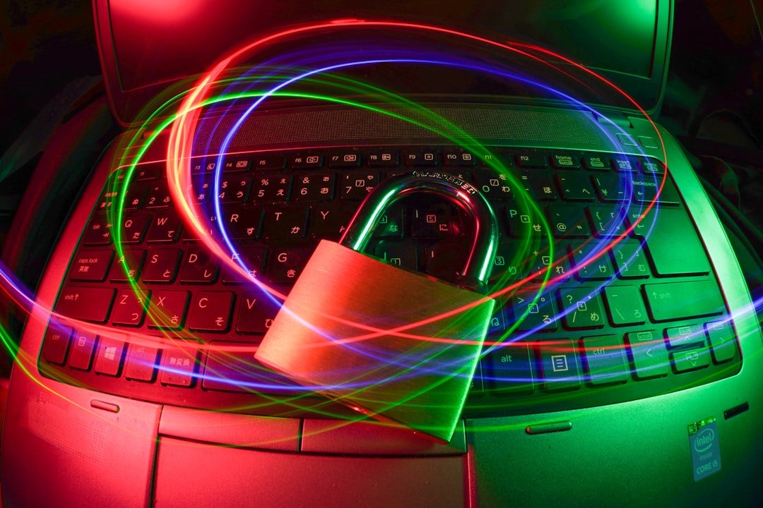 abstract cybersecurity data protection — Photo by FlyD on Unsplash. Source: https://unsplash.com/photos/padlock-on-laptop-with-light-trails-C5pXRFEjq3w